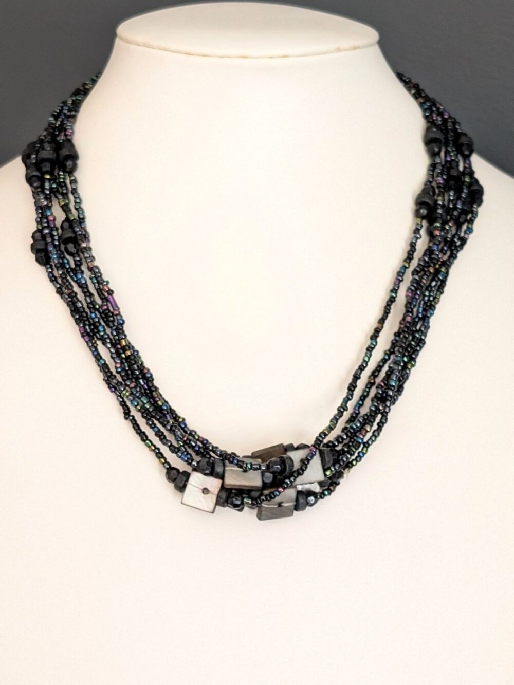 Seed beads necklace with black bead and shell accents